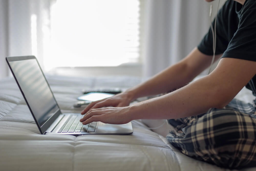 Student sitting on their laptop