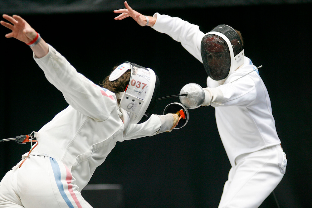 2 students in a fencing match | Command Education