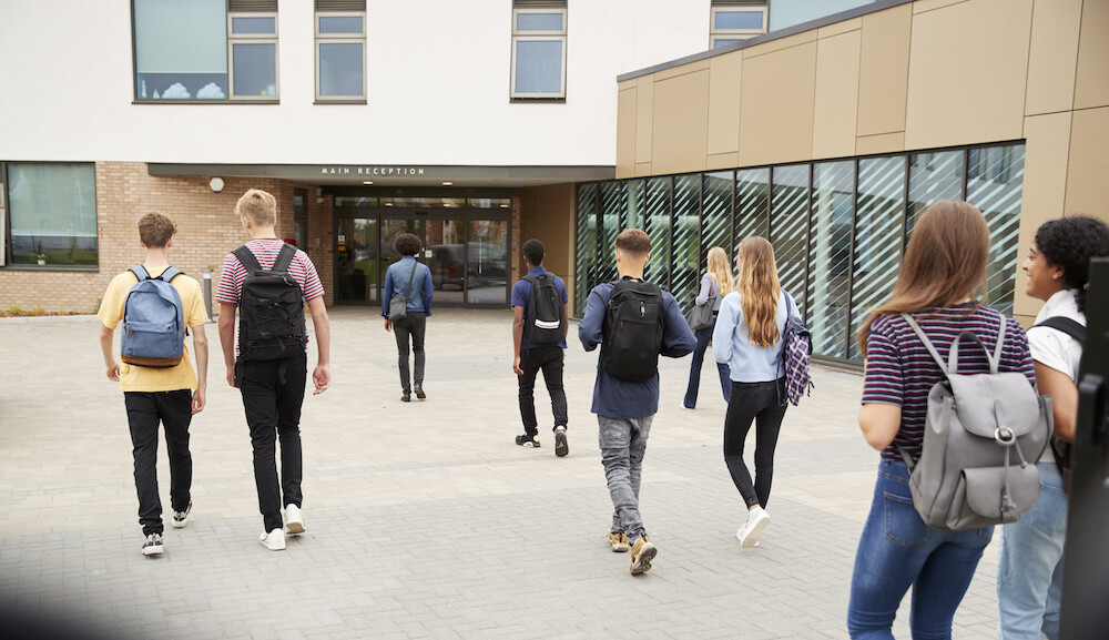 high school students entering a school