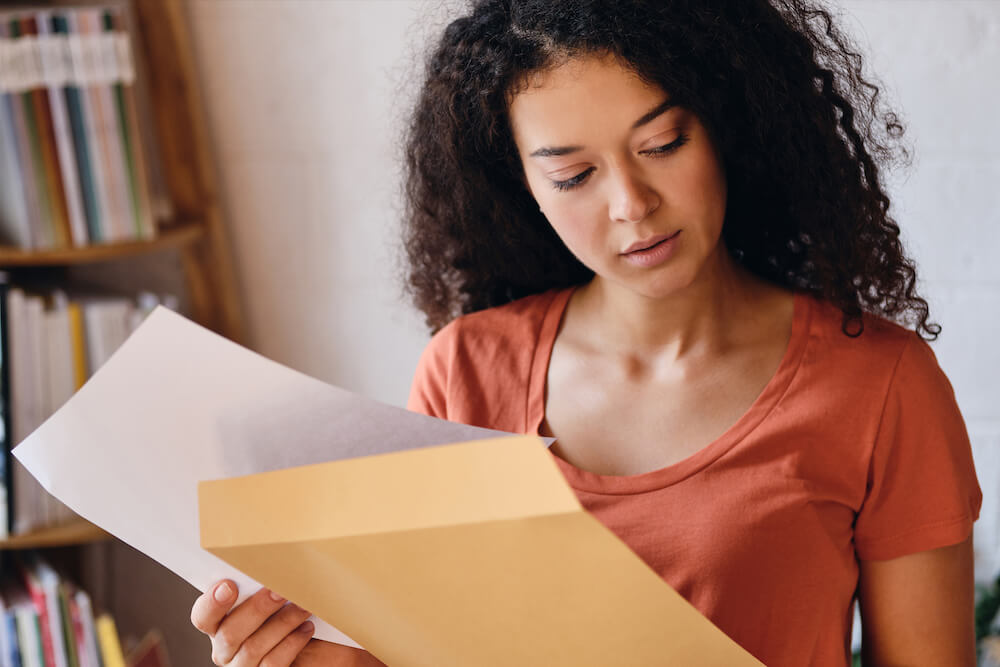 Student reading a Likely Letter for College