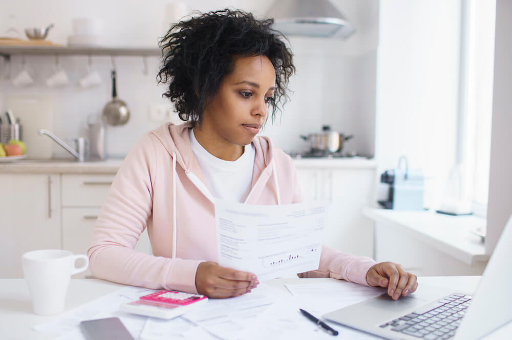 Student working at laptop learning about financial aid for college and university