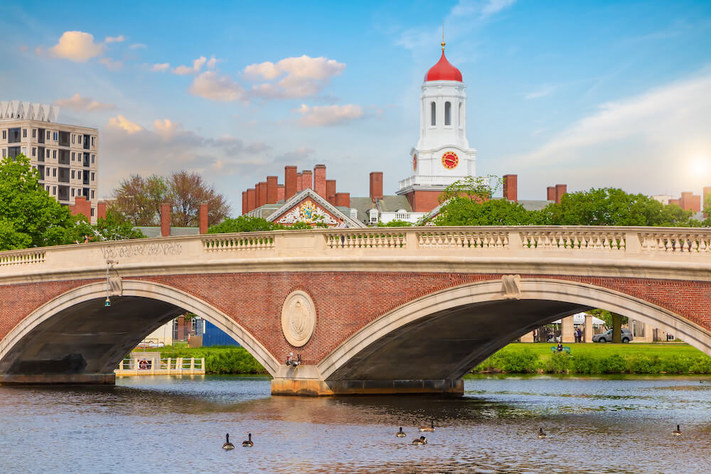 John W. Weeks vintage Bridge with clock tower over Charles River in Harvard University campus Boston, Command Education