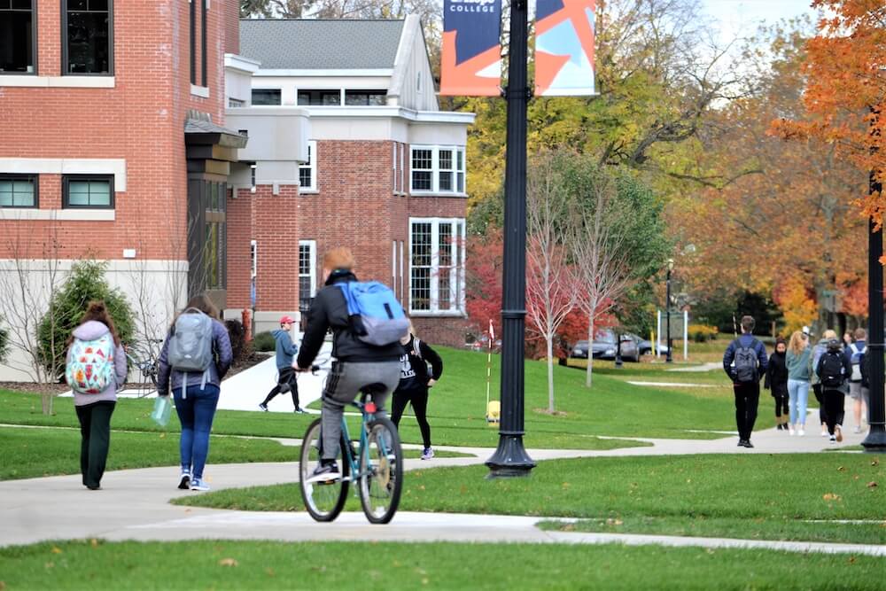 College students between class on campus in the fall