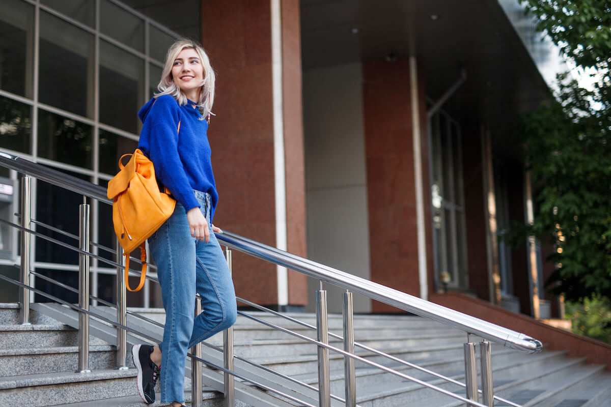 college visit guide woman on steps on campus
