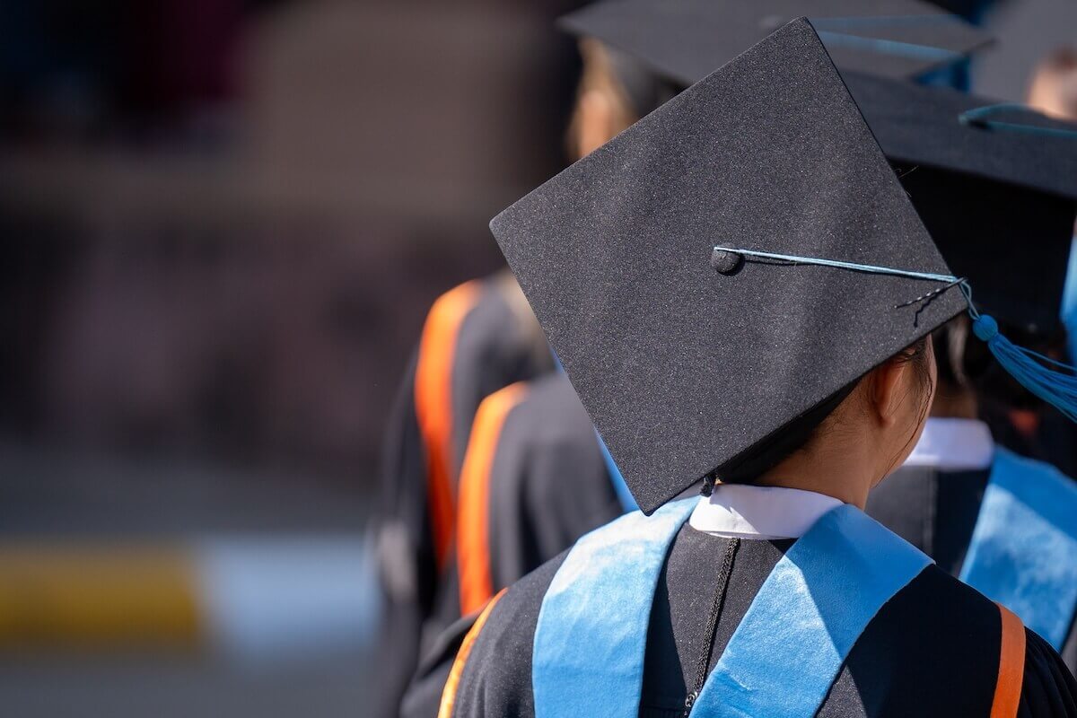 Close-up of students in graduation caps and gowns during an Ivy League commencement ceremony, highlighting academic achievement and selective college admissions.