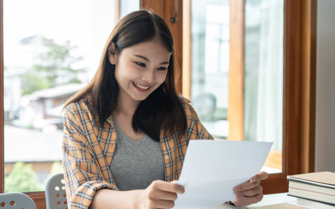woman student is smiling and reading the good news 2024 10 18 04 01 09 utc