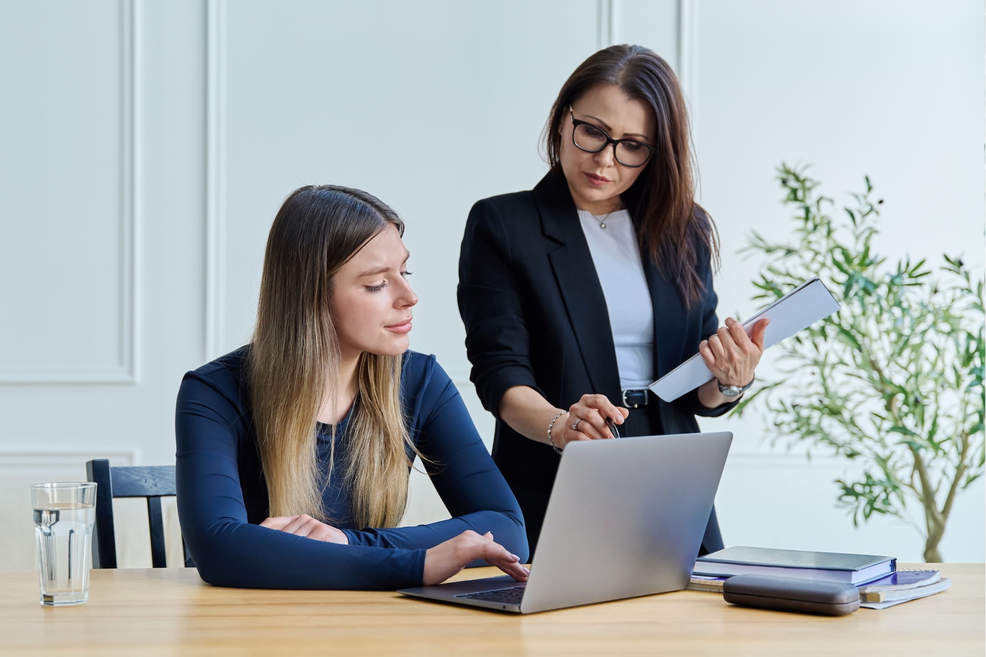 College student receiving career coaching from a professional advisor during a one-on-one laptop session