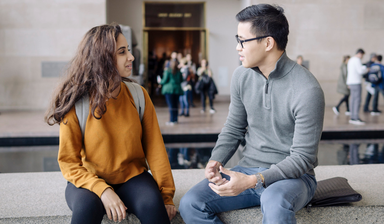 chris-and-student Chris and Student meeting in a lobby of an office building