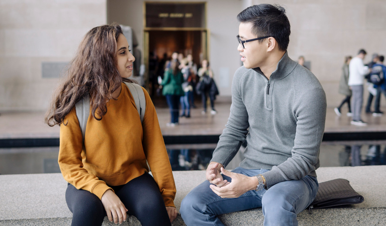 Chris and Student meeting in a lobby of an office building