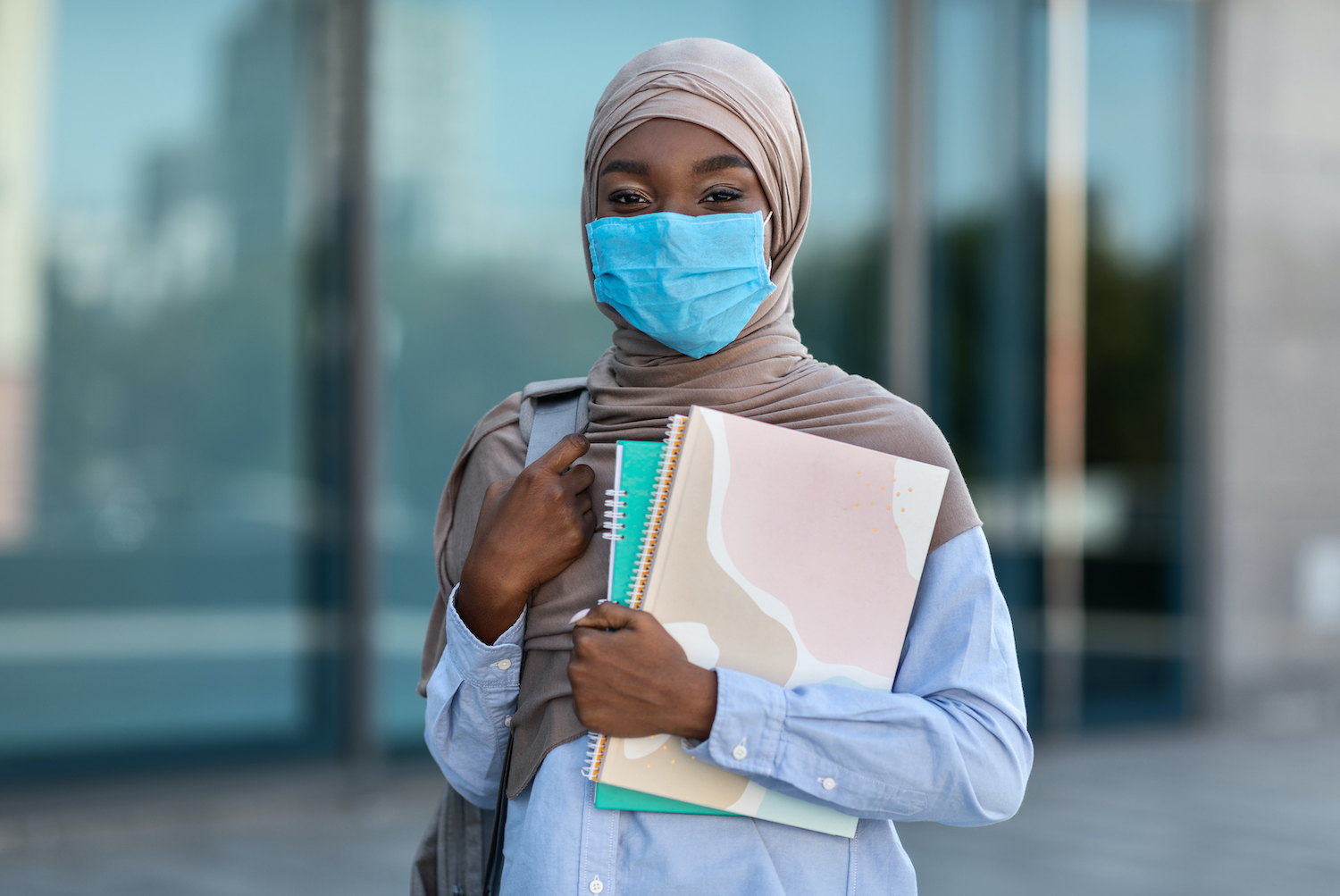 Study During Coronavirus. African Muslim Female Student In Medical Mask Posing Outdoors